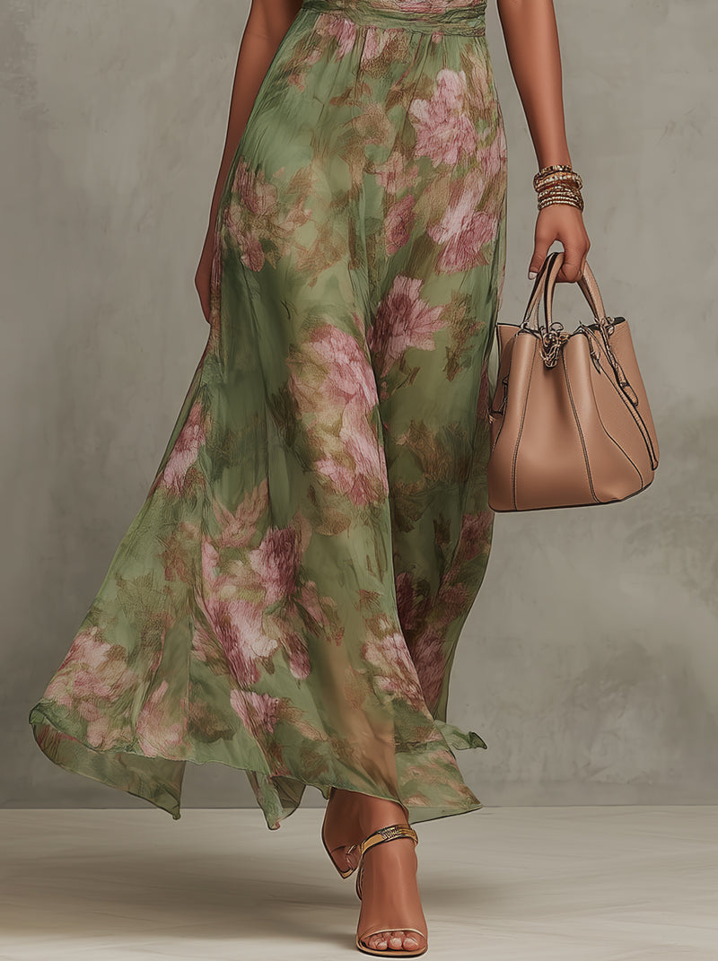 Long green floral chiffon dress with a low back.